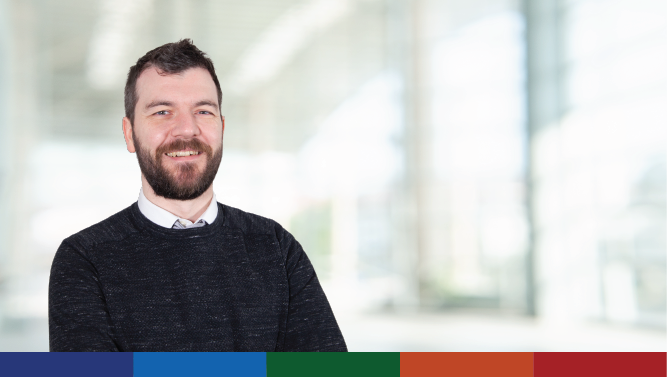 An image of a staff member smiling.