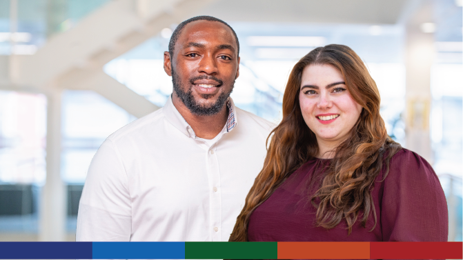 An image of two staff members in an office stairwell.